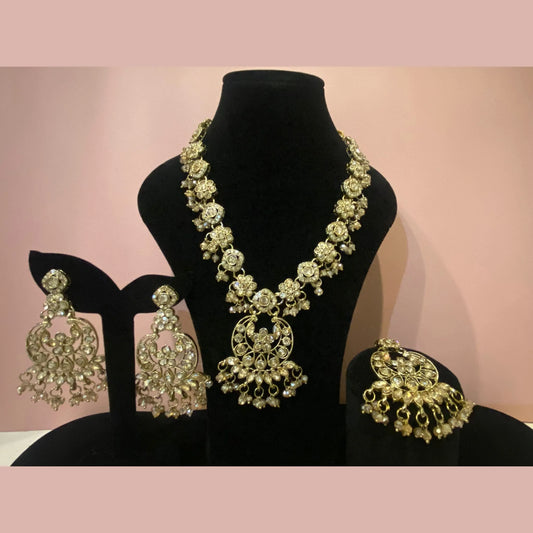 Gold pearl necklace with moon earrings and maang tikka