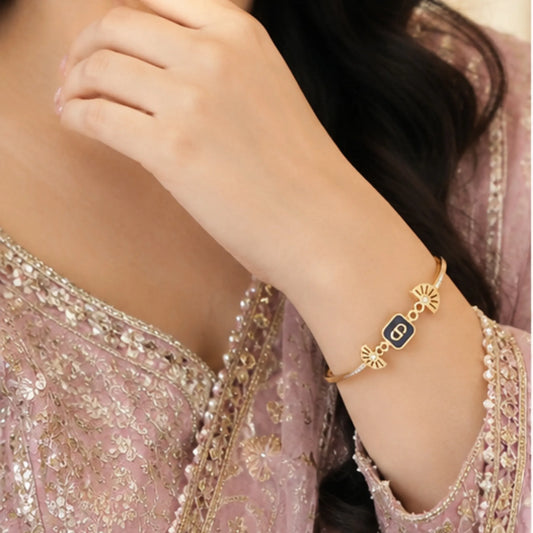 Elegant Gold-Toned Enamel Eclipse Cuff Bracelet
