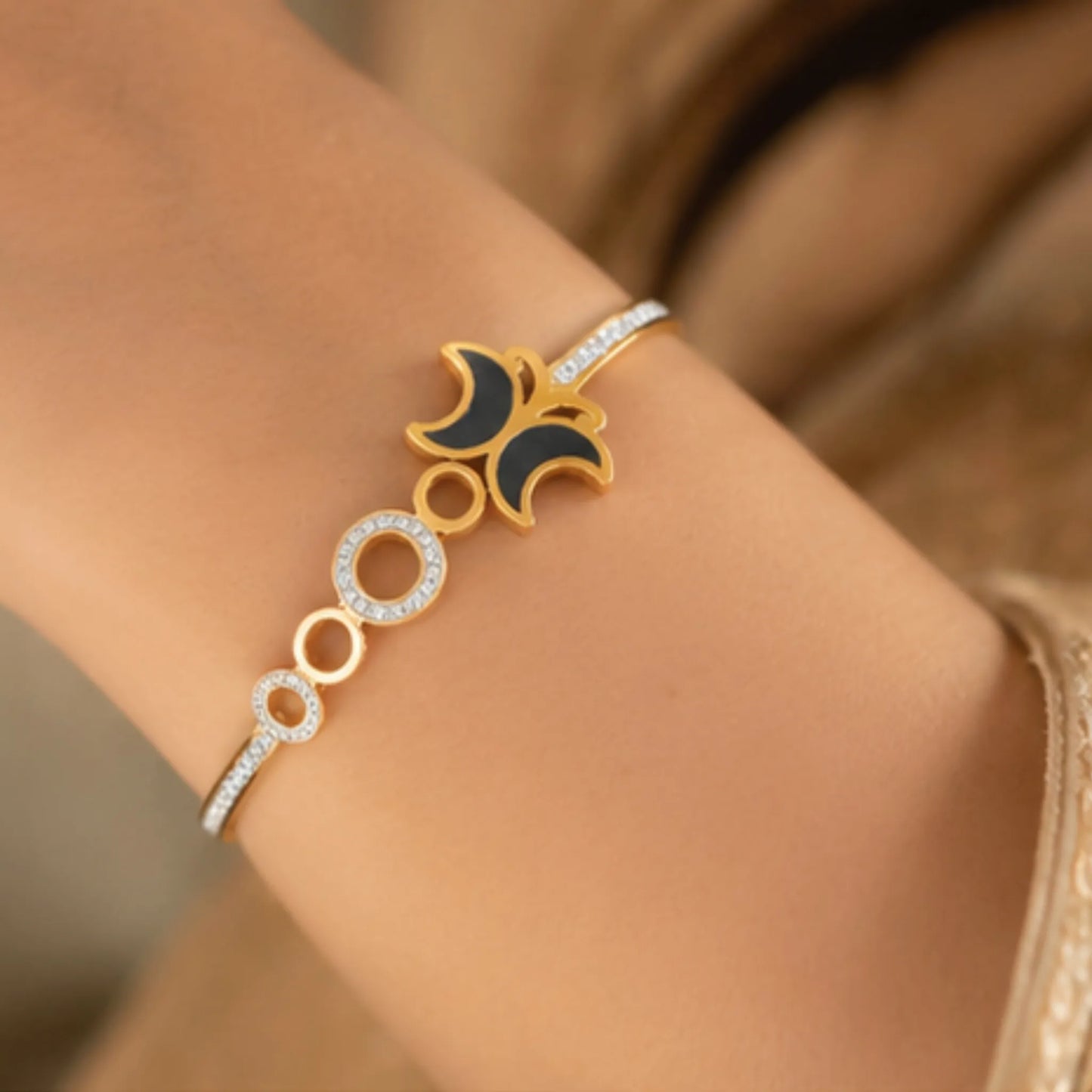 Elegant Gold-Toned Enamel Eclipse Cuff Bracelet