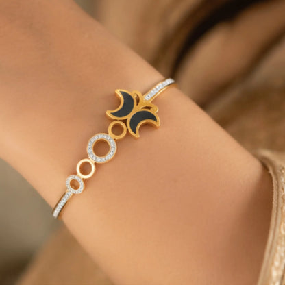 Elegant Gold-Toned Enamel Eclipse Cuff Bracelet