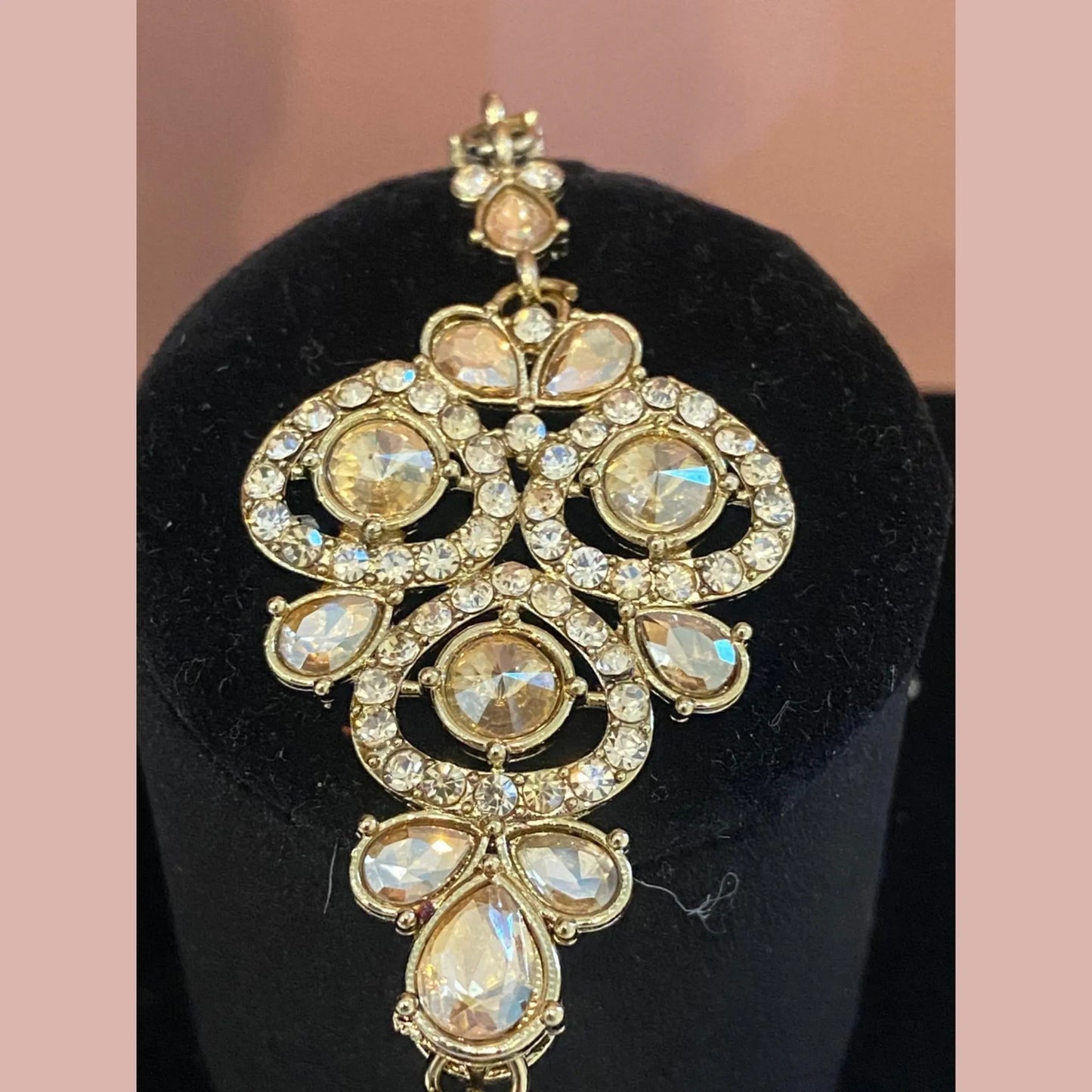 Golden necklace with peach stones