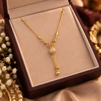 Elegant Gold-Tone Beaded Pendant Necklace with Crystal Ball & Dangling Charms