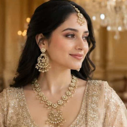 Gold pearl necklace with moon earrings and maang tikka